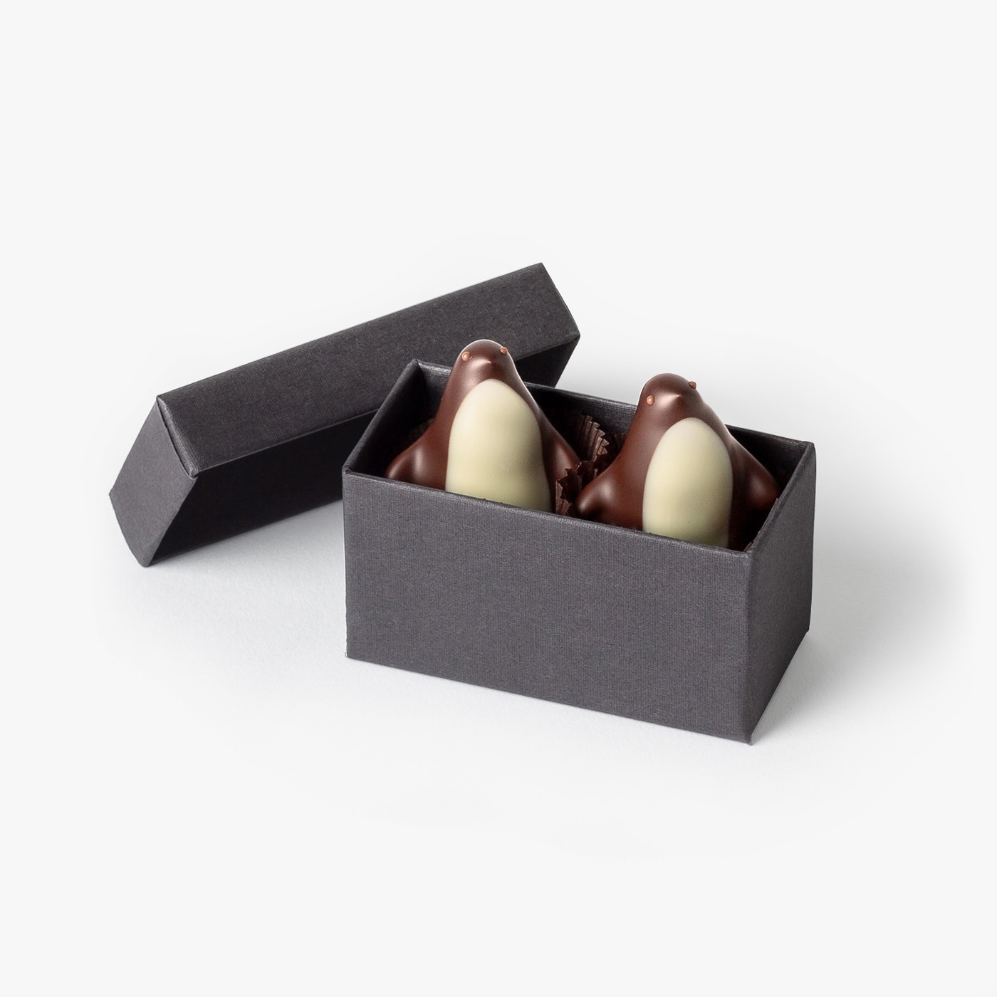 Chocolate Gift Box. Handmade Chocolate Penquins have a whipped dark chocolate ganache with a hint of fresh lemon and are finished with toasted almond wings.